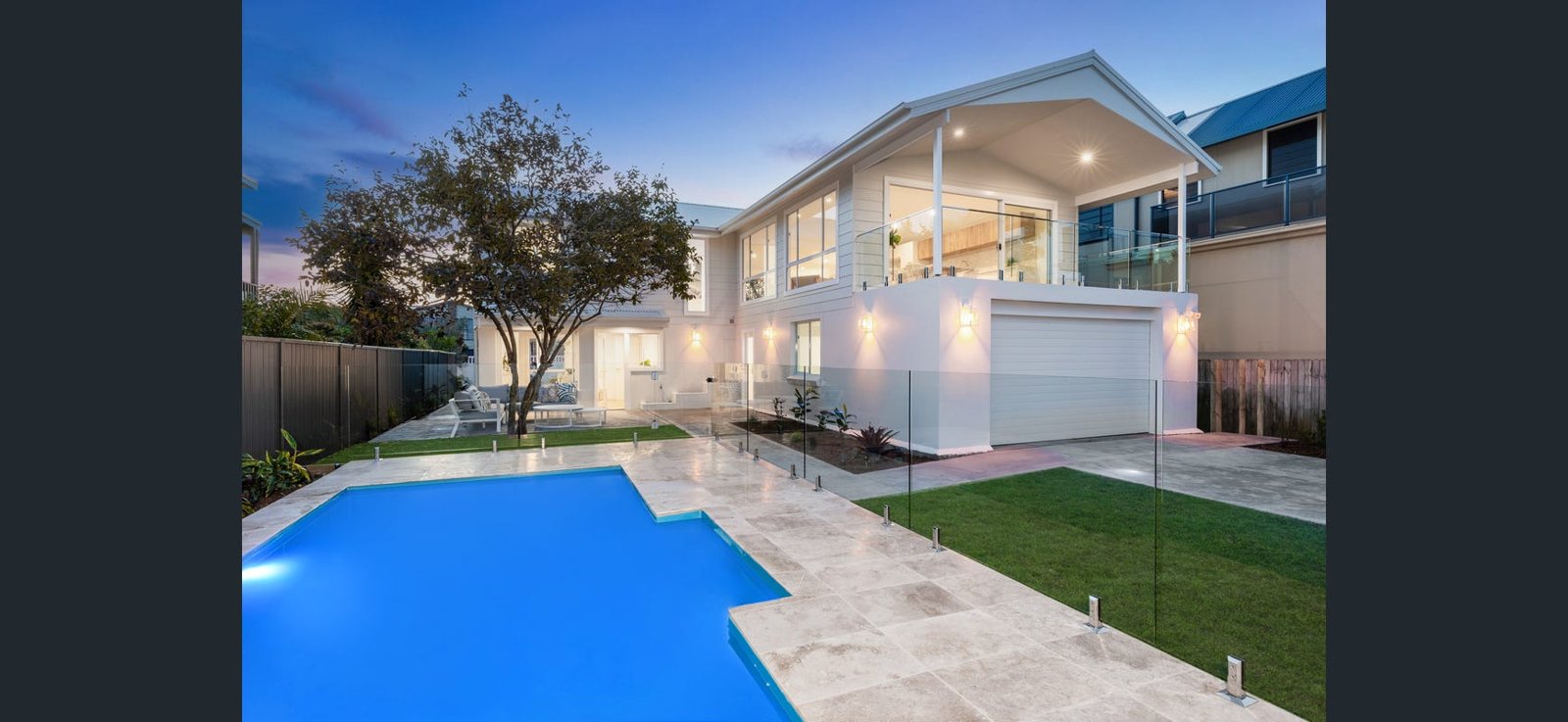 A fibreglass pool shell set and levelled in a backyard, before backfill